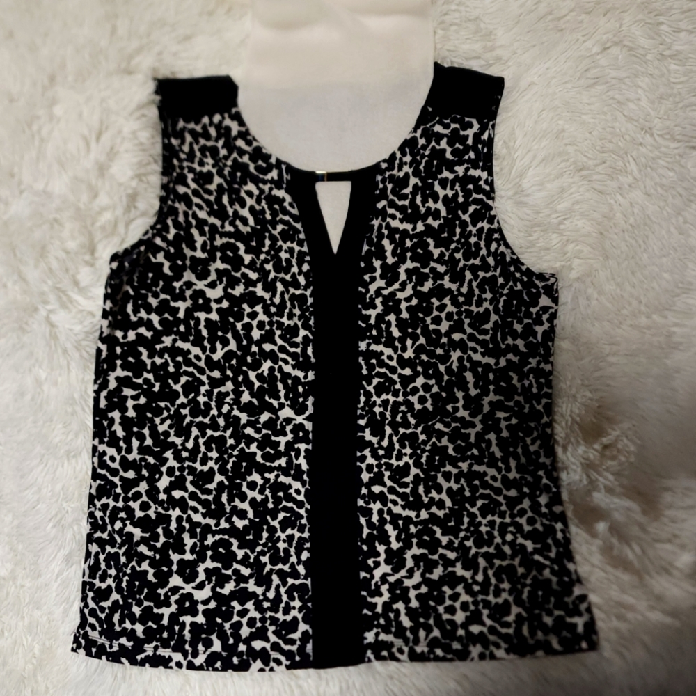 Ladies black and white sleeveless blouse with v neck